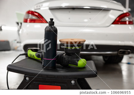 Bottle of special wax or polish cream and disk grinding machine Bottle of special wax or polish cream and disk grinding machine 106696955