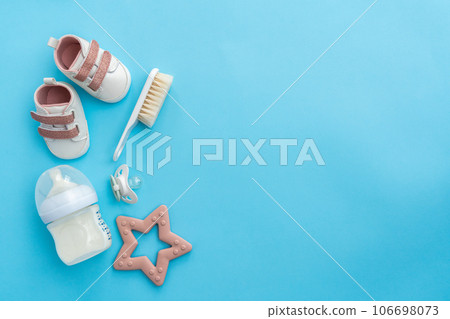 Laying out baby necessities: an aerial view on blue Laying out baby necessities: an aerial view on blue 106698073
