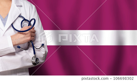 Latvian medicine and healthcare concept. Doctor close up against flag of Latvia background 106698302