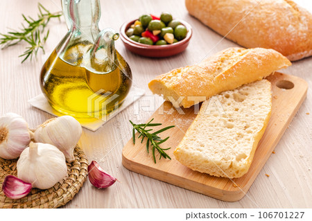 rustic bread and olive oil ready to make toasts 106701227
