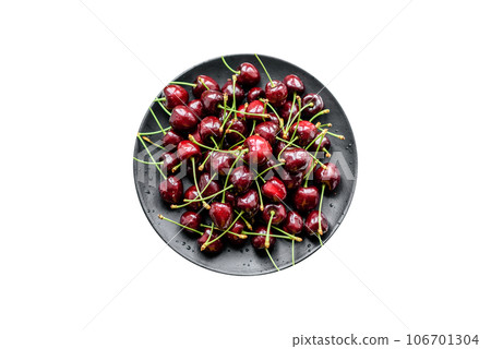 Fresh sweet cherries plate with leaves in water drops on stone background, top view 106701304