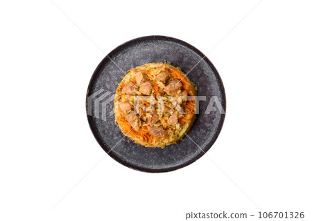 Pilaf or pilau with chicken, traditional uzbek hot dish of boiled rice and chicken meat Pilaf or pilau with chicken, traditional uzbek hot dish of boiled rice and chicken meat 106701326