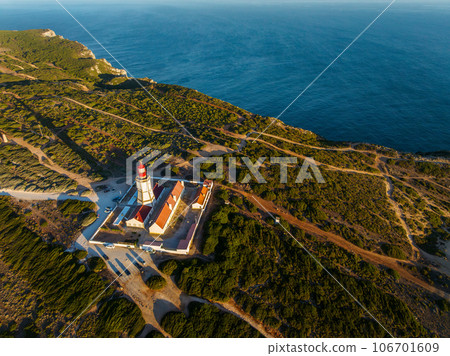 Aerial drone view of lighthouse on Cabo Espichel cape Espichel on Atlantic ocean 106701609