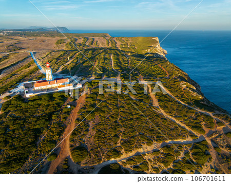 Aerial drone view of lighthouse on Cabo Espichel cape Espichel on Atlantic ocean 106701611