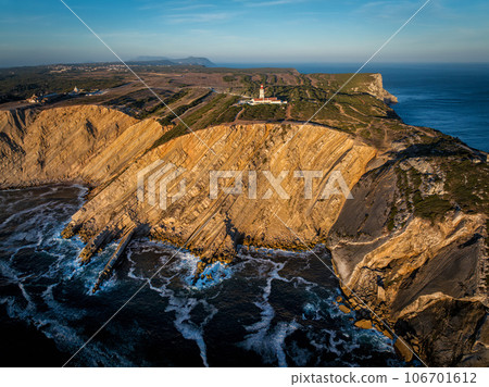 Aerial drone view of lighthouse on Cabo Espichel cape Espichel on Atlantic ocean Aerial drone view of lighthouse on Cabo Espichel cape Espichel on Atlantic ocean 106701612