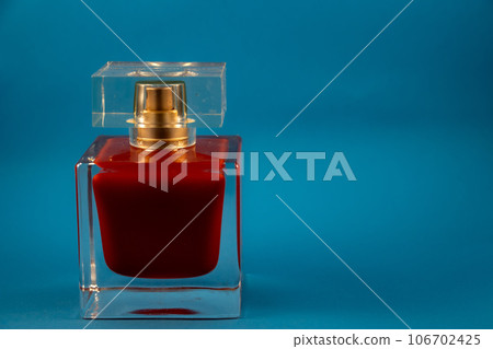 original packaging of women's perfume on a blue background original packaging of women's perfume on a blue background 106702425