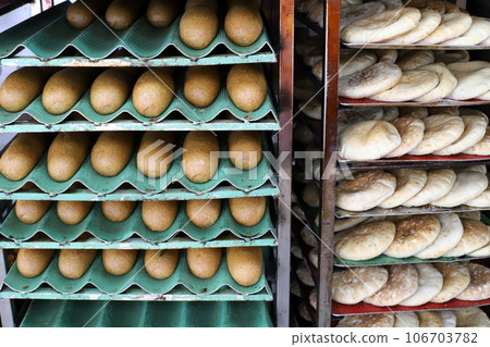 bread and bakery products are sold in a store in Israel. 106703782