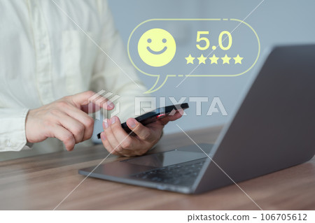 Male customer using a mobile phone or smartphone in give rating to service experience assessment on application. Online customer review satisfaction feedback survey and testimonial. Male customer using a mobile phone or smartphone in give rating to service experience assessment on application. Online customer review satisfaction feedback survey and testimonial. 106705612