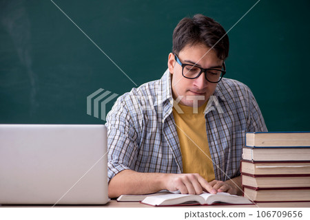 Young male student preparing for exams in the classroom 106709656
