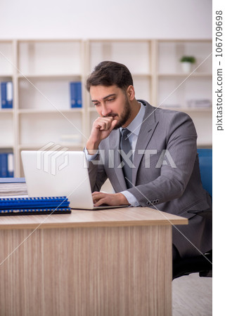 Young male employee working in the office 106709698