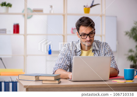 Young male freelancer working from home 106710338