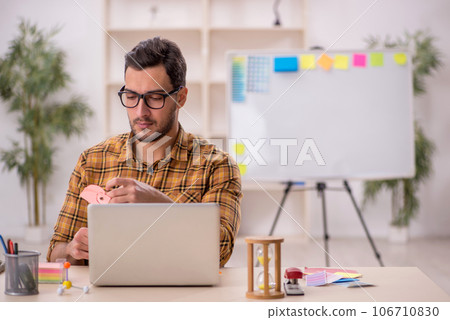 Young male designer working in the office 106710830
