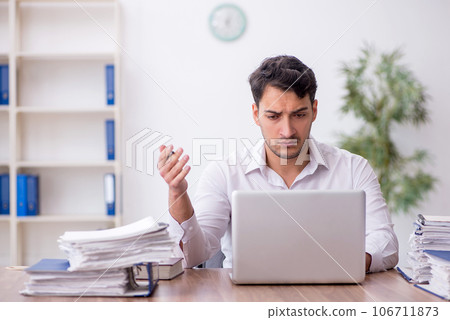 Young male employee working in the office 106711873