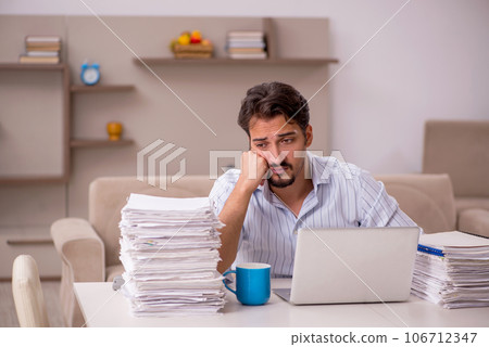 Young businessman employee working from home during pandemic Young businessman employee working from home during pandemic 106712347