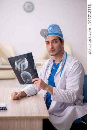 Young male doctor radiologist working in the clinic Young male doctor radiologist working in the clinic 106712388