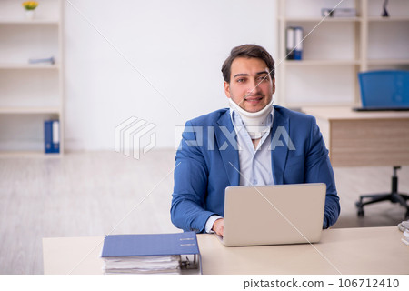 Young male employee after car accident at workplace 106712410