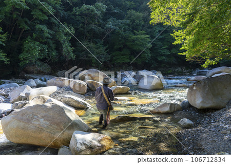 Fly fishing mountain stream fishing 106712834