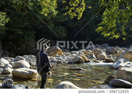 Fly fishing mountain stream fishing Fly fishing mountain stream fishing 106712835