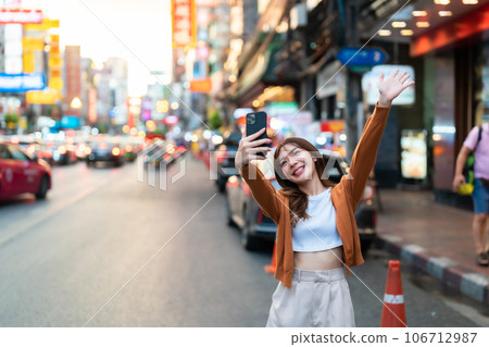 Young Asian tourists standing selfie taking a photo Young Asian tourists standing selfie taking a photo 106712987
