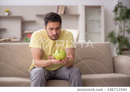 Young man in unemployment concept at home Young man in unemployment concept at home 106712994