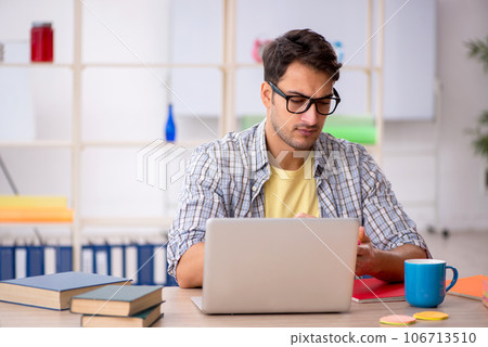 Young male freelancer working from home 106713510