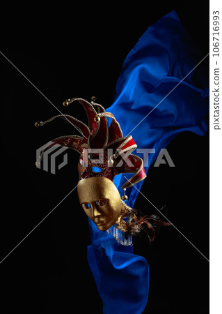 Old carnival masks with flutters blue cloth. Old carnival masks with flutters blue cloth. 106716993