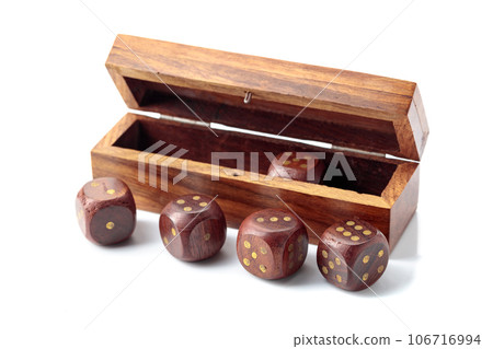The old wooden dice isolated on a white background. 106716994