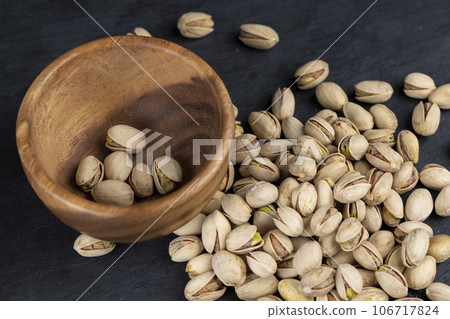 a large number of salty and crispy pistachios close-up a large number of salty and crispy pistachios close-up 106717824