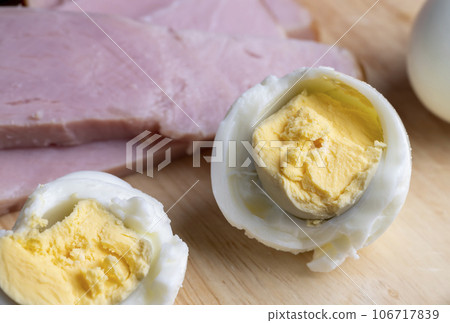 Boiled chicken egg with sliced pieces of meat Boiled chicken egg with sliced pieces of meat 106717839