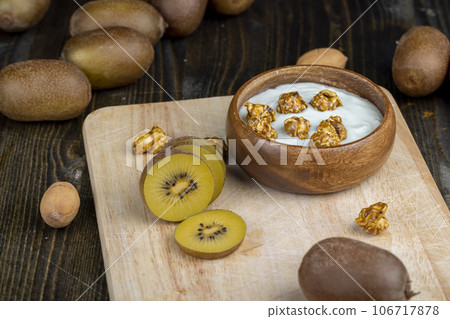 fresh yogurt with kiwi flavor and with pieces of fruit and popcorn fresh yogurt with kiwi flavor and with pieces of fruit and popcorn 106717878