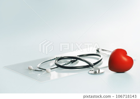 Medical or healthcare concept banner. Heart. stethoscope on on a gray desk. Doctor appointment or checkups schedule, PPE. Copy space. Banner 106718143