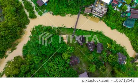 Village and mountain in Vang Vieng, Laos, Nam Song River in Vang Vieng, Laos. Village and mountain in Vang Vieng, Laos, Nam Song River in Vang Vieng, Laos. 106718542