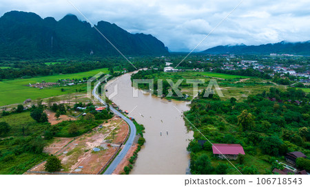 Village and mountain in Vang Vieng, Laos, Nam Song River in Vang Vieng, Laos. 106718543