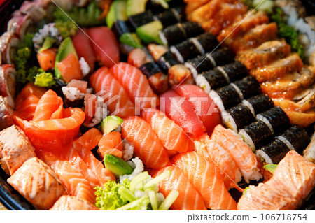 Assorted Sushi Nigiri and Maki Big Set on Slate. A Variety of Japanese Sushi with Tuna, Crab, Salmon, Eel, and Rolls. Top View. 106718754