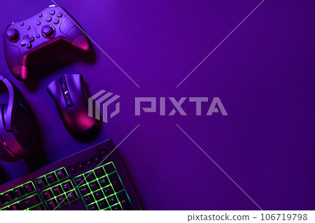 Gaming gadgets under pink light Gaming gadgets under pink light 106719798