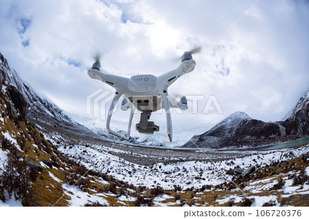 Flying drone taking picture of landscape in Tibet, China 106720376