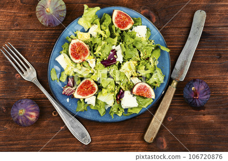 Figs salad with cheese on wooden table Figs salad with cheese on wooden table 106720876