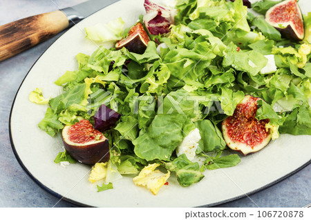 Salad with figs, herbs and cheese. 106720878