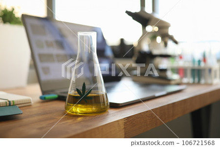 Test tube with yellow cbd oil in chemisrtry lab Test tube with yellow cbd oil in chemisrtry lab 106721568