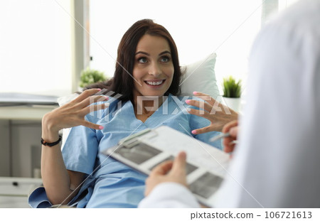 Adult caucasian beautiful woman shows doctor Adult caucasian beautiful woman shows doctor 106721613