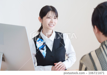 Smiling female reception staff 106721871
