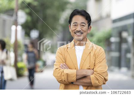 A man in his mid-50s smiling at the camera A man in his mid-50s smiling at the camera 106722683