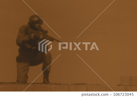 SWAT police sniper in black uniform in action on the roof top 106723045