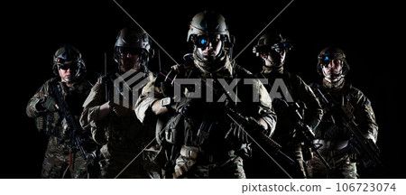 United States Army rangers with assault rifle on dark background United States Army rangers with assault rifle on dark background 106723074
