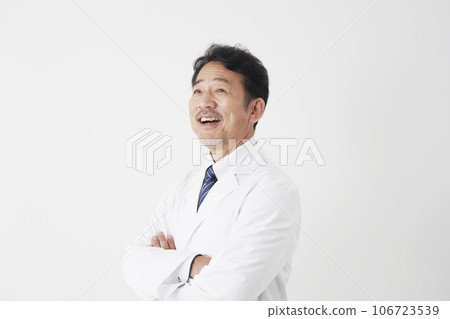 Portrait of a smiling middle-aged doctor, white background Portrait of a smiling middle-aged doctor, white background 106723539