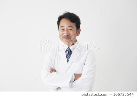 Portrait of a smiling middle-aged doctor, white background, looking at camera 106723544