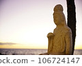 sunset and buddha statue 106724147