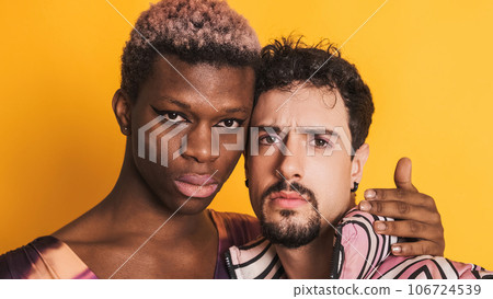 Multiethnic transgender and gay men looking at the camera with a serious look 106724539