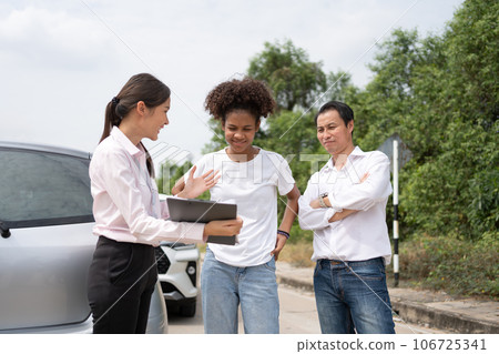 Two Asian driver Talk to Insurance Agent for examining damaged car and customer checking on report claim form after an accident. Concept of insurance and car traffic accidents. Two Asian driver Talk to Insurance Agent for examining damaged car and customer checking on report claim form after an accident. Concept of insurance and car traffic accidents. 106725341