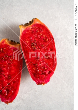 Prickly pears, exotic cactus fruits cut in halves, top view. Prickly pears, exotic cactus fruits cut in halves, top view. 106726676